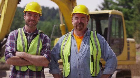 Portrait of two construction workers
