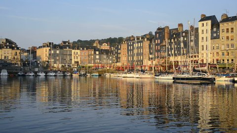 Honfleur harbour in Normandy, France. Color houses and their reflection in water 