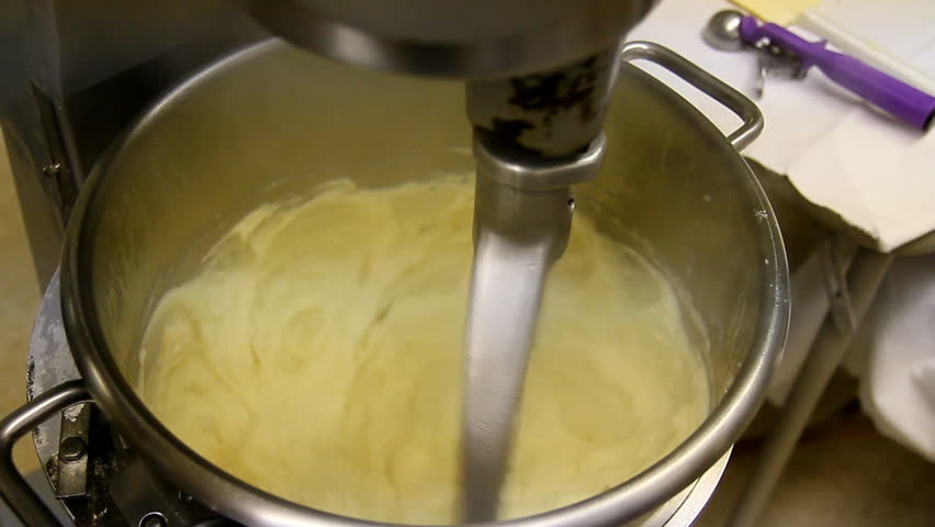 Mixing potatoes in an industrial mixer.