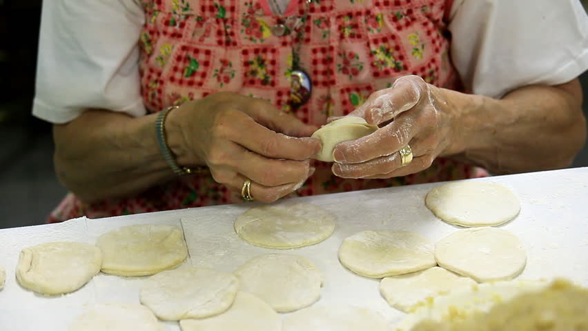 Volunteers prepare and pinch pierogies to be sold at a church fundraiser.