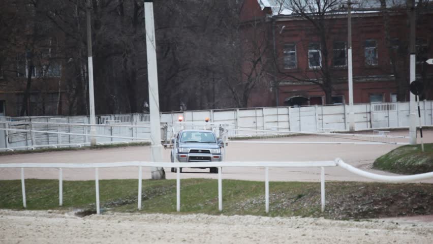 start of horse competitions on hippodrome with auto start car 