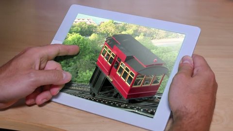 Flipping through a photo album on an iPad or tablet PC.
