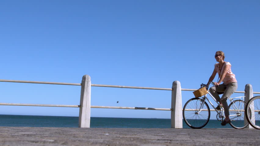 Senior couple going on a bike ride in the city on the pier in slow motion Royalty-Free Stock Footage #7283851