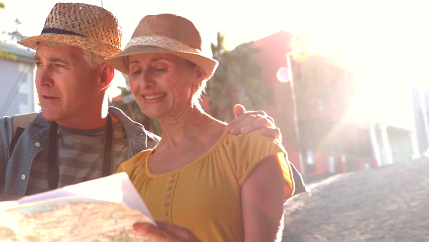 Senior couple looking at the map and pointing in slow motion Royalty-Free Stock Footage #7285528