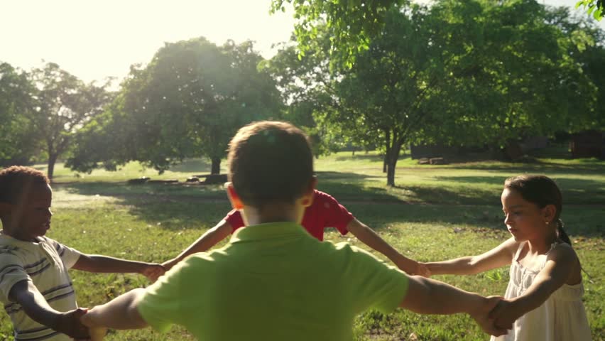 Hispanic and african american little boys and girls playing ring around the rosie in city park and holding hands. Young kids, friends, people, recreation, summer camp fun. Slow motion. 7of18 Royalty-Free Stock Footage #7290004