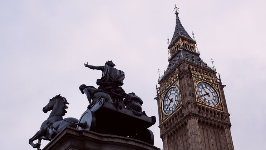 Time lapse at sunset of the Big Ben clock on the Houses of Parliament and the statue of Boadicea (Boudica). 4K