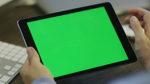 Designer using Digital Tablet with Green Screen at Work in Landscape Mode
Shot on RED Camera in 4K, so you can easily crop, rotate and zoom. ProResHQ codec  - Great for editing, color correction