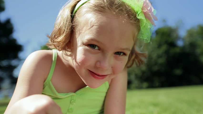 Little Girl Looks At Camera And Smiles Wide | Shutterstock HD Video #7320202