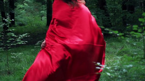 Woman in red cape run away in forest, super slow motion, 240fps
