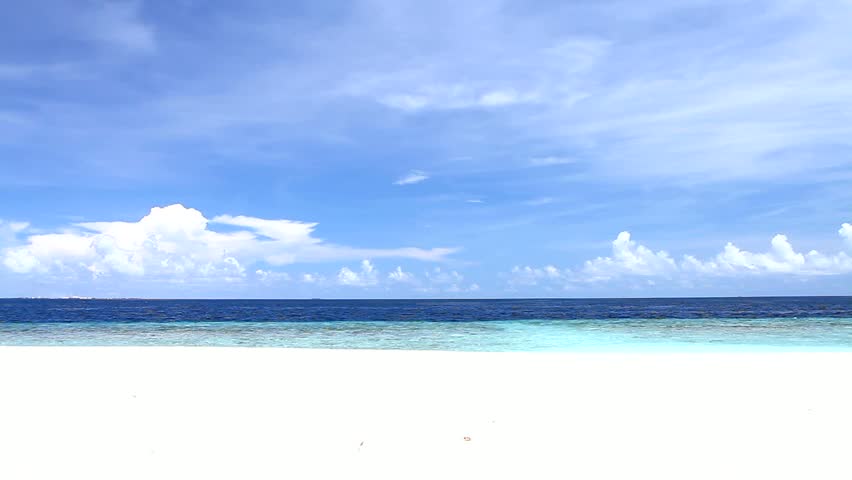 Tropical Paradise at Maldives with white beach and blue sky 