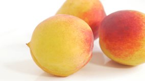 Peaches on white juicy fruit close-up UHD 4K 2160p footage - Peach on white background 3840X2160 UHD fruit video
