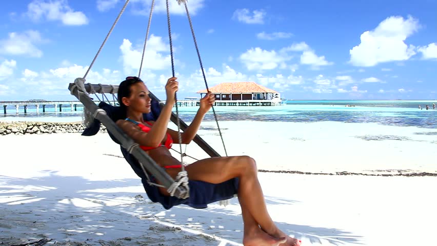 Beautiful and sexy woman resting at Maldives seaside 