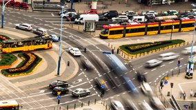 Collection of clips of city traffic at rush hour with many cars, trams, buses moving fast in time lapse, taken in Warsaw, Poland