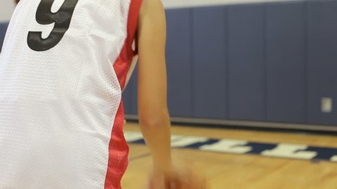 Female High School Basketball Player Scoring Basket