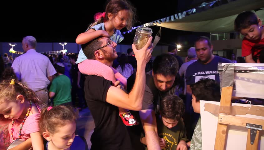 HAIFA, ISRAEL – SEPTEMBER 18: Kids and parents examine marine biological specimens, instruments and tools during Open Door Scientists Night at the Oceanographic and Limnological Research center, 2014