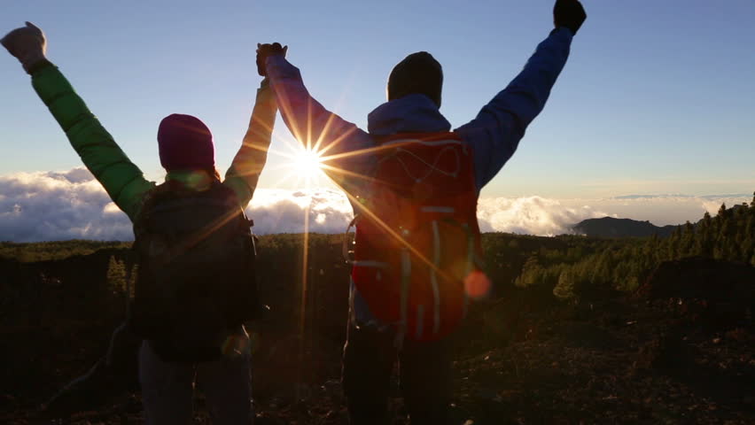 Success, achievement and accomplishment concept with hiking people cheering jumping, running and celebrating of joy on trekking hike outside. Hikers having fun at sunset. Royalty-Free Stock Footage #7367362