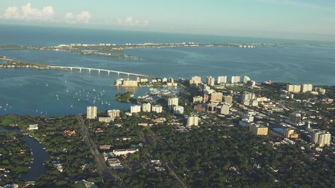 Sarasota, Florida 4k aerial, early morning light, looking towards gulf. Building just catching the morning sunrise.