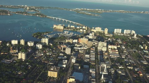 Sarasota, Florida 4k aerial, early morning light, looking towards gulf. Building just catching the morning sunrise.
