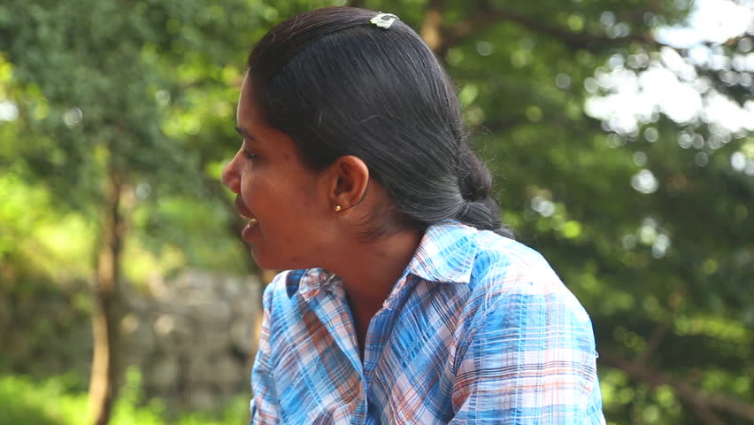 SIGIRIYA, SRI LANKA - FEBRUARY 2014: Portrait of local working woman in Sigiriya. The site employs many locals supporting their families. | Shutterstock HD Video #7390198