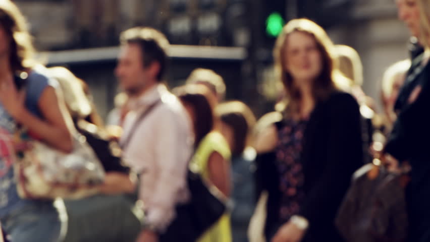 Anonymous crowd of people walking London City street slow motion