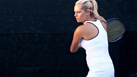 Female tennis player in action. Slow motion conformed from 60fps.