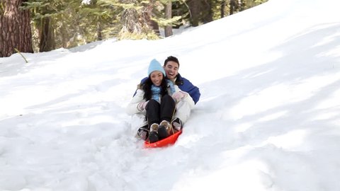 Young couple having fun in the snow.