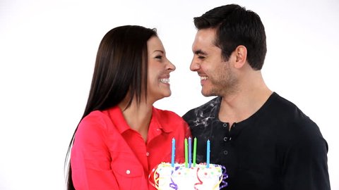 Attractive young couple celebrating the woman's birthday.