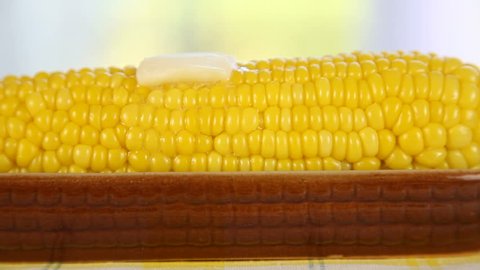 Butter melting on a piece of corn on the cob.