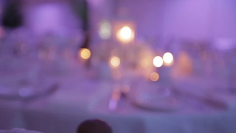 Decorative table setting pan with candle lights at a wedding reception. 1080p HD.
