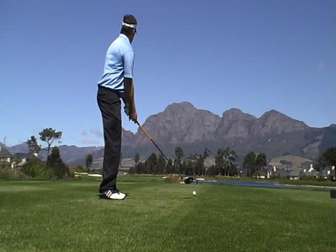 Man playing golf on a beautiful golf course