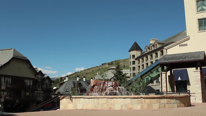 Fountain with waterfall in a generic mountain town. Beaver Creek, Colorado. 1080p HD with natural sound.