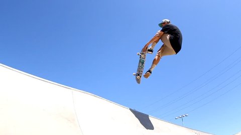 Skateboarder mid-air. Slow motion conformed from 60fps.