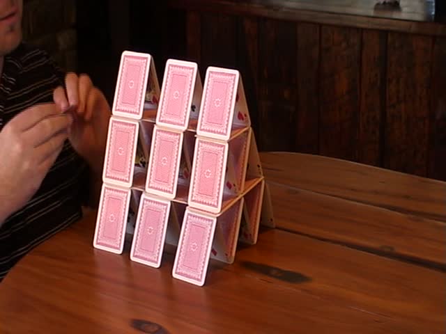 Man building a card house
