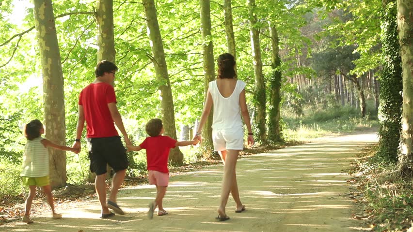 Family walking in rural road outdoors