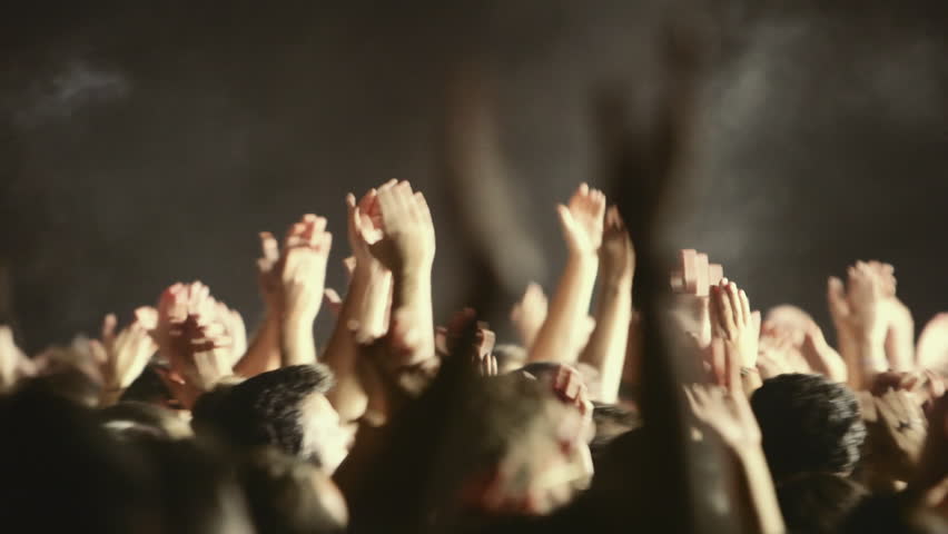 Various crowd shots from an outdoors summer/autumn rock music festival in Athens Greece.Fans throwing hands in the air applauding and cheering.