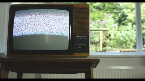 Analogue television disappears from UK airwaves. 76 years of television history came to an end at midnight on Wednesday 24 October 2012 when the analogue TV signal was switched off. (UK, July 2014)