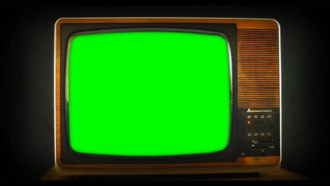 Zoom into vintage Analog TV with green screen. 76 years of television history came to an end at midnight on Wednesday 24 October 2012 when the analogue TV signal was switched off. (UK, July 2014) 