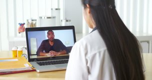Chinese doctor video chatting with African patient