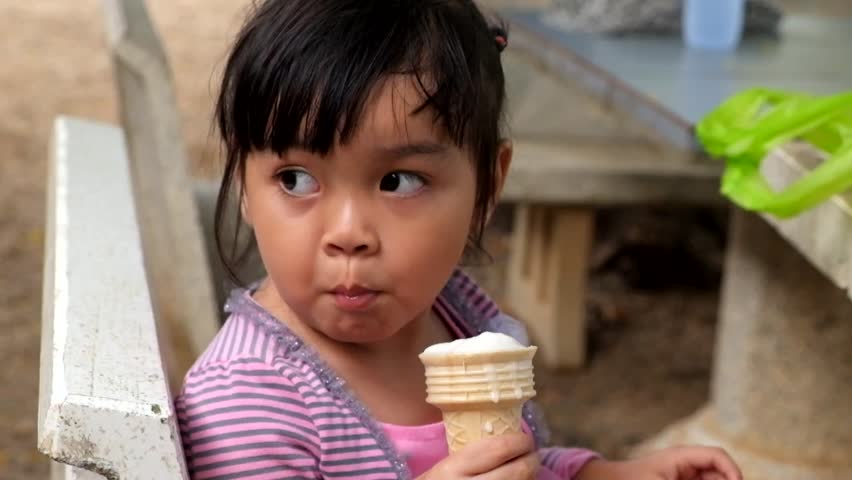 Cute Asian Girl Enjoys A Stock Footage Video 100 Royaltyfree
