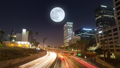 Commuter freeway city traffic in downtown Los Angeles at night. 4K UHD Timelapse in motion (hyperlapse).