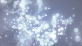 Abstract motion background, shining light, stars, particles, rays, seamless looping.