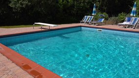 Italy, Tuscany, swimming pool in agriturismo hotel, former farmstead.