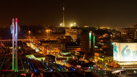 Johannesburg, Gauteng, South Africa - 25/07/2013    A colourful display of nighttime traffic crossing the Nelson Mandela Bridge in the city centre.
