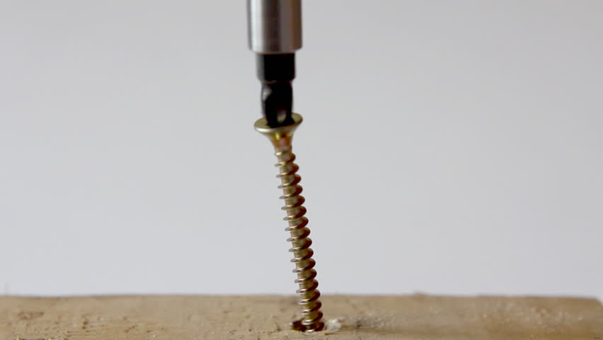 electricity screwdriver turning screw close-up 