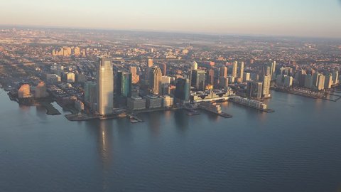 JERSEY CITY sunrise and early morning light panning North up Hudson River. Shot in 4K, dedicated plane, hard mounted open window allows a saturated, clear edge on the shot.