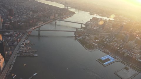 New York City East River, Brooklyn Bridge sunrise and early morning light. Shot in 4K, dedicated plane, hard mounted open window allows a saturated, clear edge on the shot.