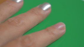 Nail art green screen background 4K 2160p UHD footage - Painting nail silver color 4K 3840X2160 UHD footage