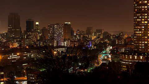 An urban timelapse with a colourful display of nighttime traffic, streets and buildings at Ponte Tower in the city centre of Johannesburg.