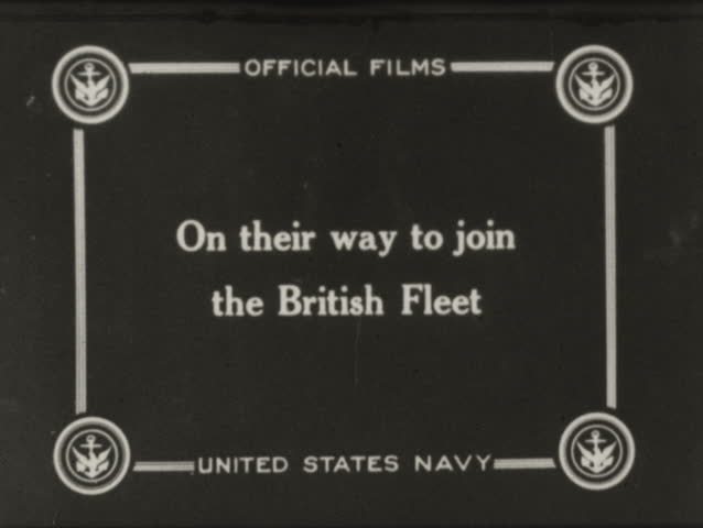 World War I - 1914-1918 - Line of battle ships cruising and firing guns. 