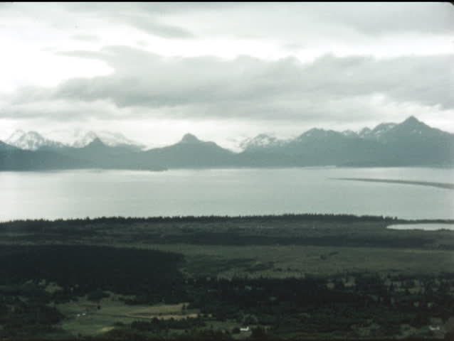View of Alaskan landscape - lake, mountain range.